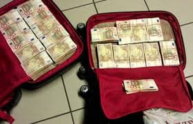 Comment la valise magique produit elle de l'argent ?